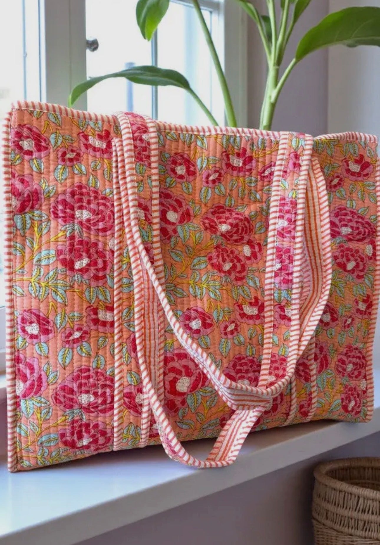 Coral floral quilted carryall
